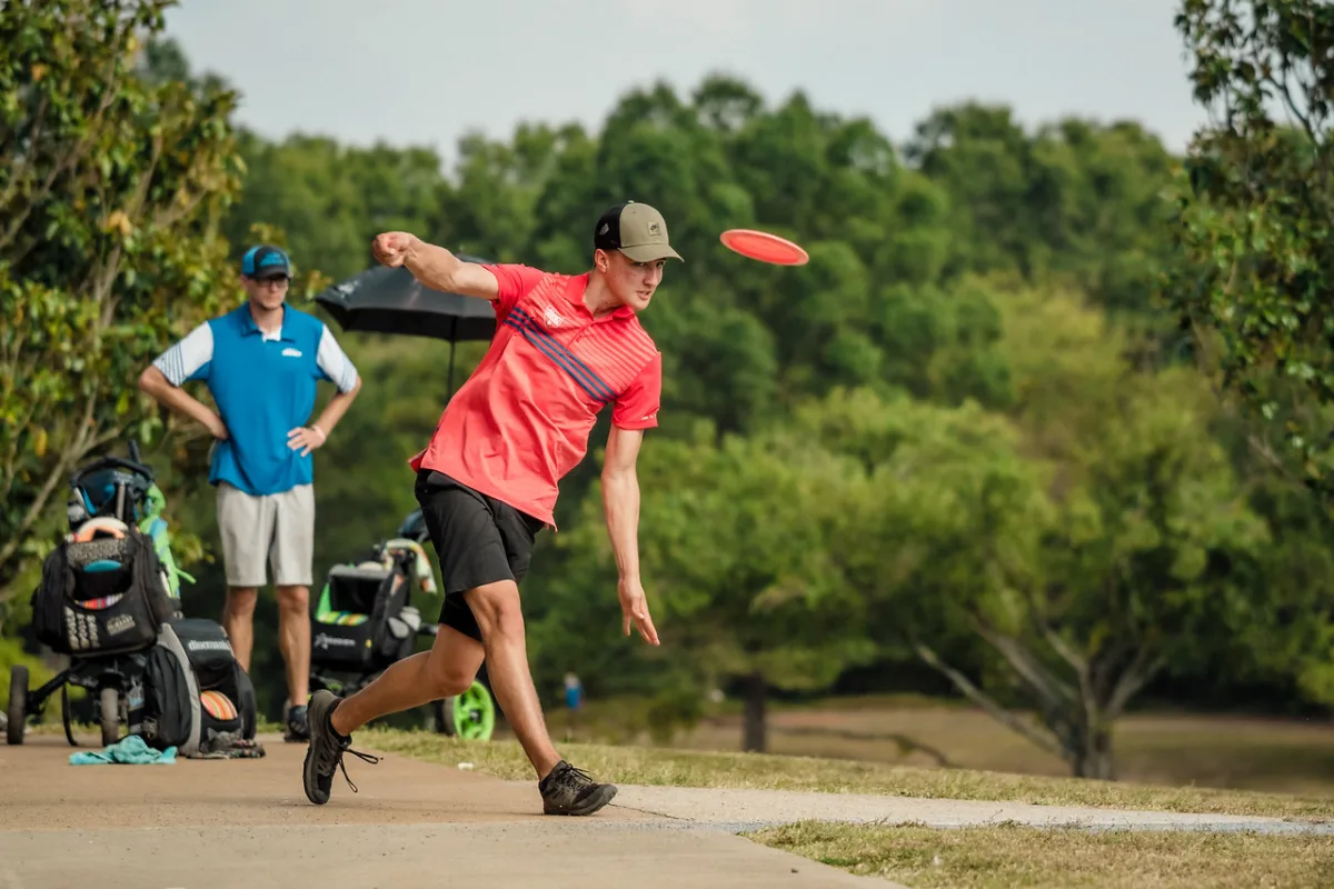 A disc golfer releases a drive at the US Disc Golf Championship.