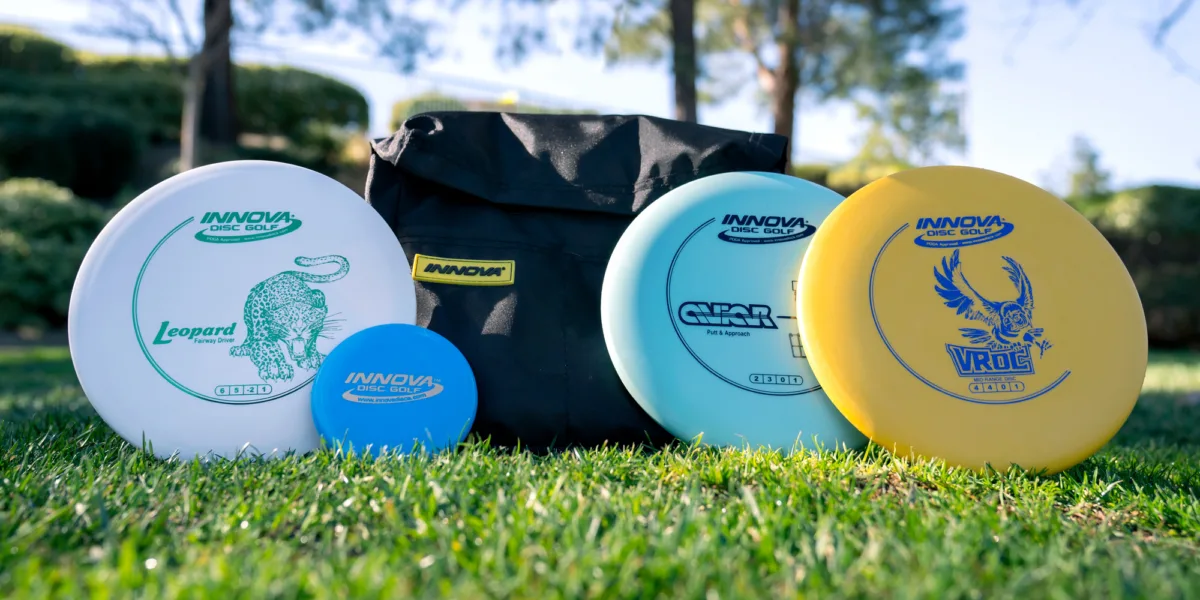 A small disc golf bag and a few discs are all you really need to start playing.