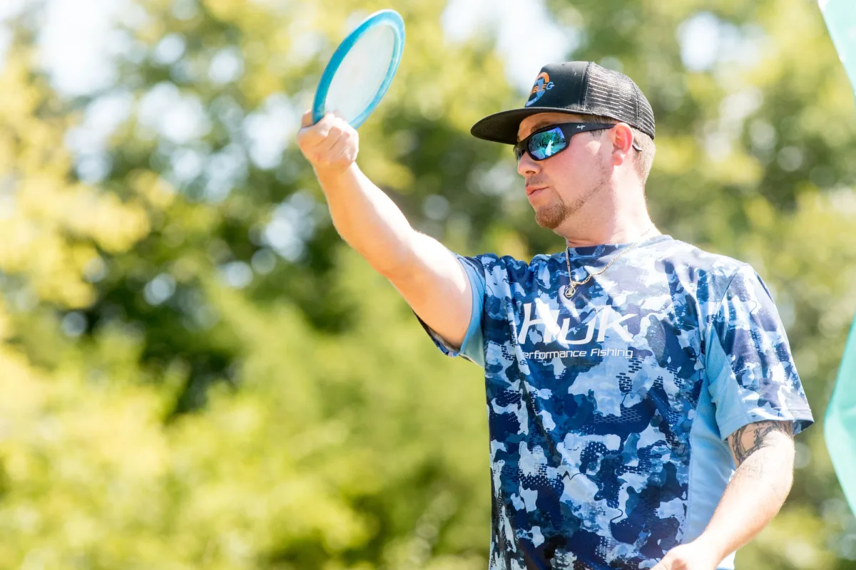 Variations of disc golf. Disc golfer preparing to throw a drive.