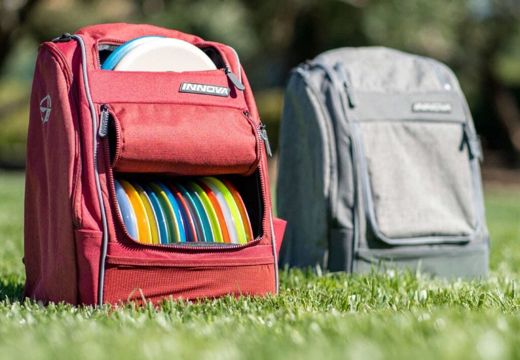 Which is the Best Disc Golf Bag? 2 Red and Grey Innova Disc Excursion bags
